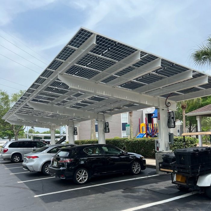 Solarizing parking lots with solar carports or elevated solar trackers