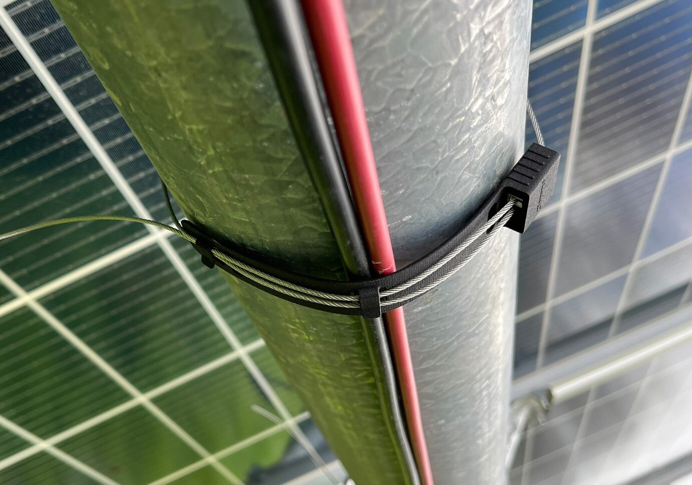 The Gripple Power-Tie holds up cables on the underside of a solar system.